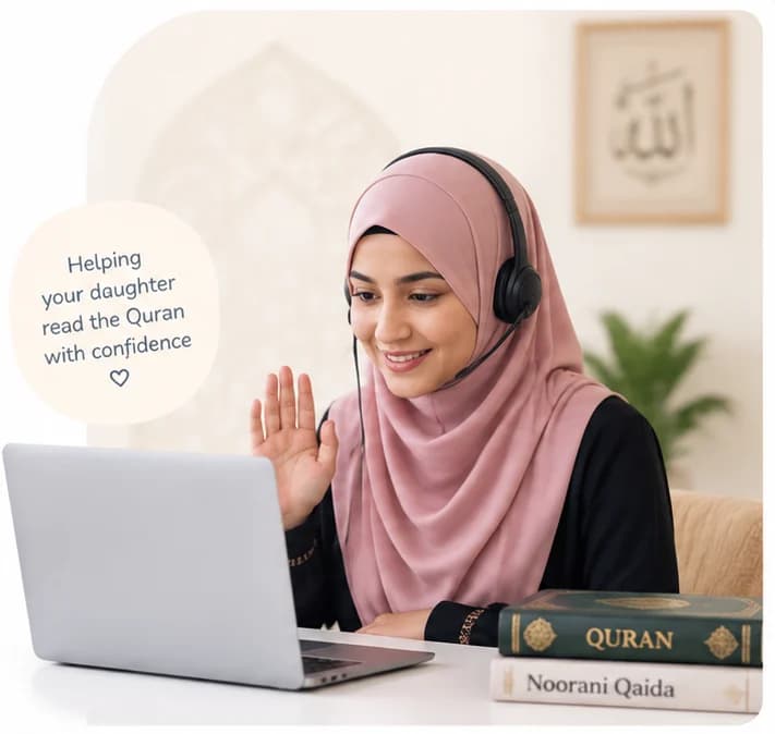 A female Quran teacher in a pink hijab and headset waving to her pupil on a laptop, a Quran and a Noorani Qaida on the desk, beside a note reading Helping your daughter read the Quran with confidence