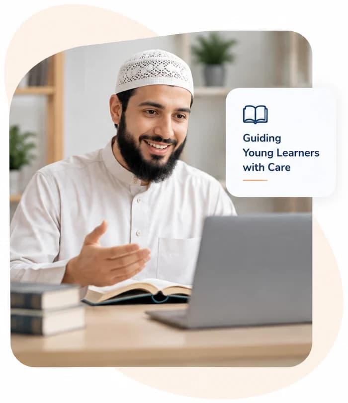 A male Quran teacher in a white cap smiling at his laptop during a lesson, an open book on the desk beside a stack of books, under a card reading Guiding Young Learners with Care